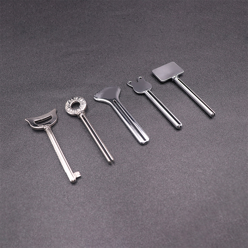 موزع معجون الأسنان المعدني، منظف الوجه، أنبوب معجون الأسنان، عصارة أنبوب مستحضرات التجميل على شكل مفتاح موزع معجون الأسنان المعدني، منظف الوجه، أنبوب معجون الأسنان، عصارة أنبوب مستحضرات التجميل على شكل مفتاح