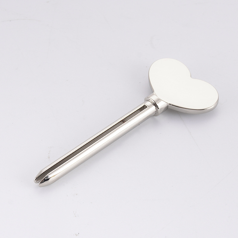 موزع معجون الأسنان المعدني، منظف الوجه، أنبوب معجون الأسنان، عصارة أنبوب مستحضرات التجميل على شكل مفتاح